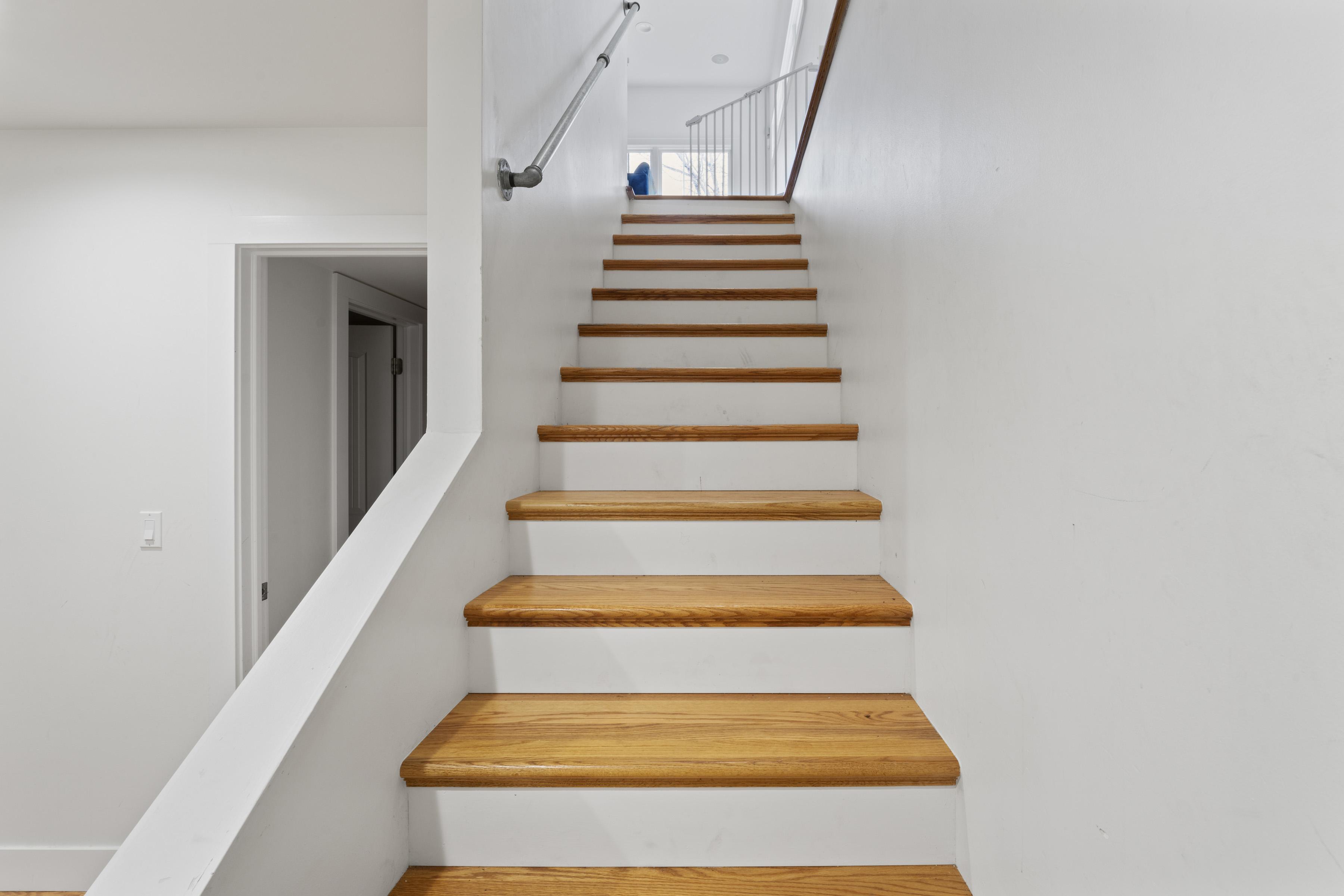 Mountain Basement stairway with updated railing